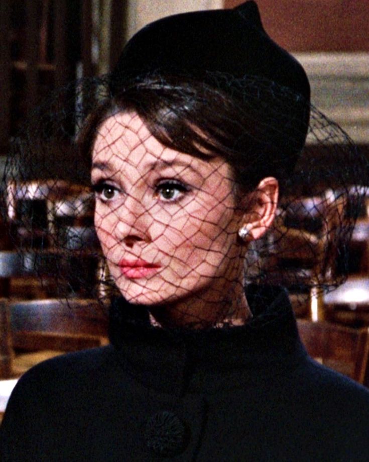 Audrey Hepburn as Regina Lampert